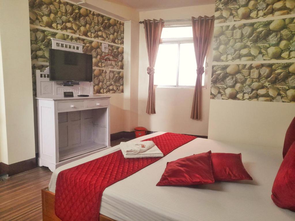 Postel nebo postele na pokoji v ubytování Mysa Homestays