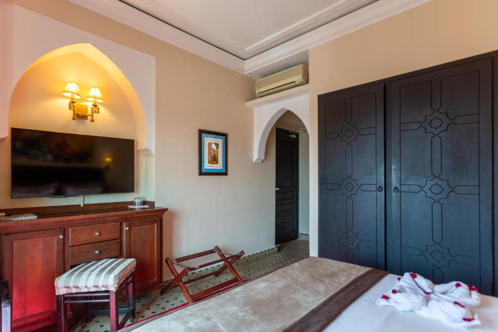 Postel nebo postele na pokoji v ubytování Le Caspien Boutique Hotel