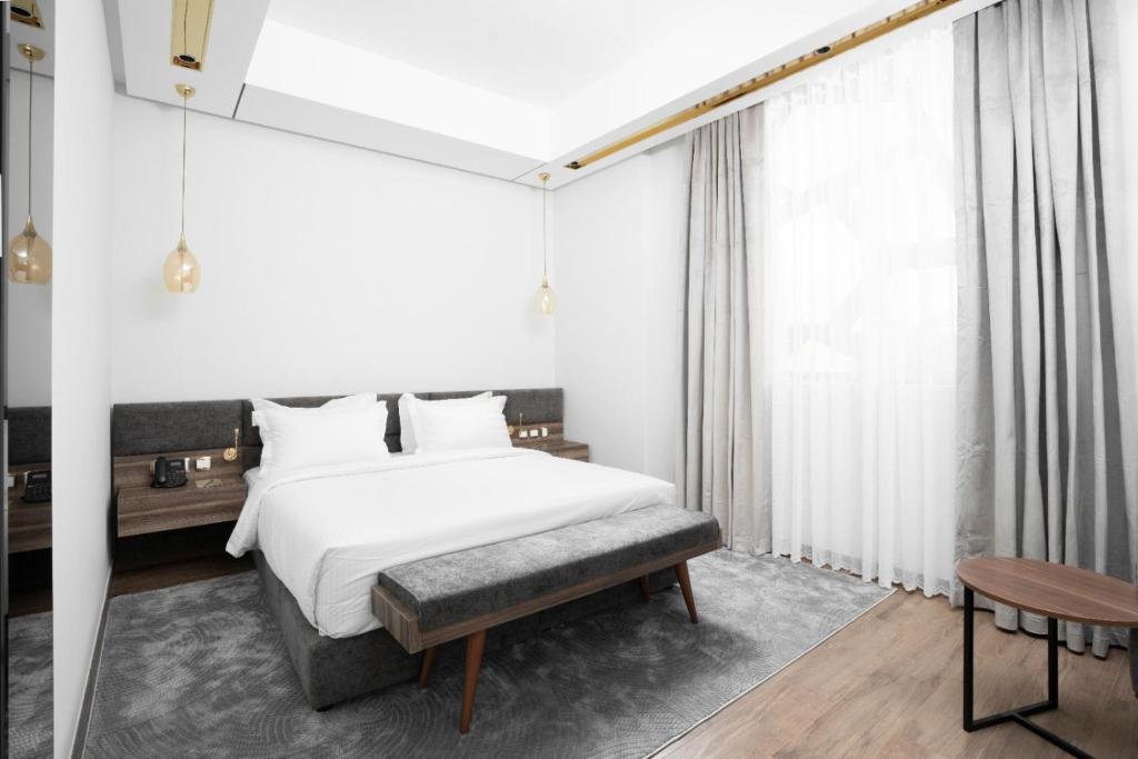 Postel nebo postele na pokoji v ubytování AKASIYA HOTEL