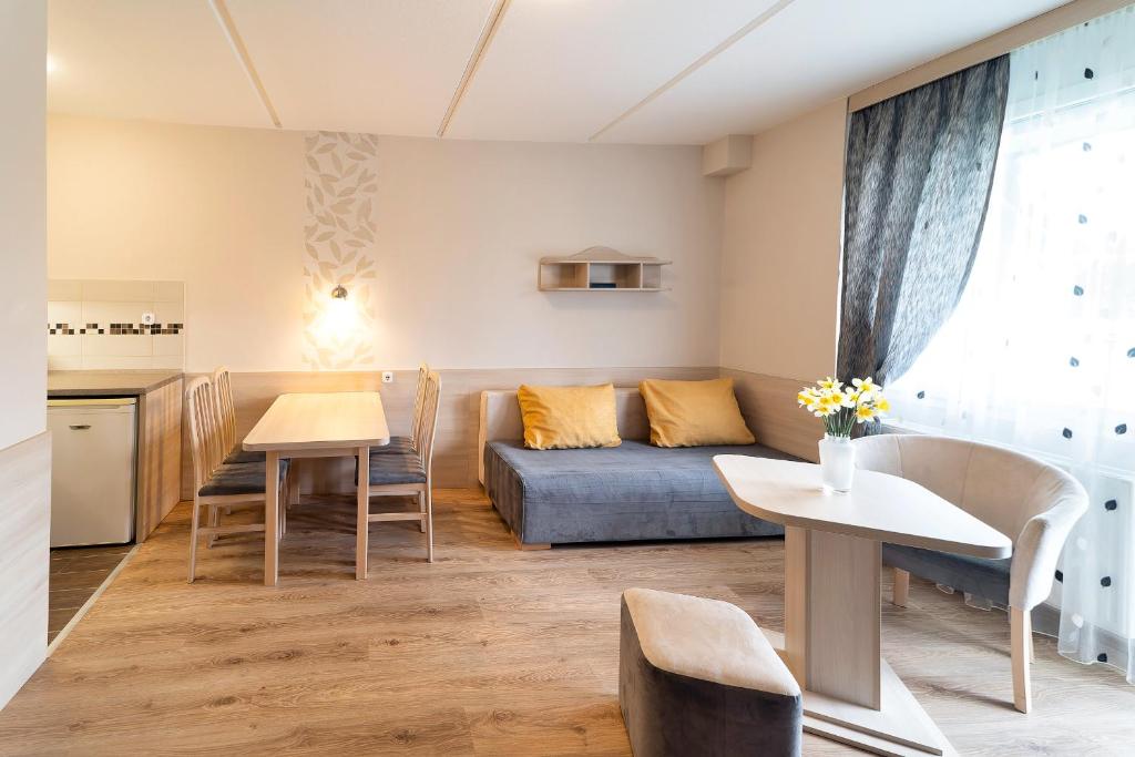 Kuchyň nebo kuchyňský kout v ubytování Napfény Hotel