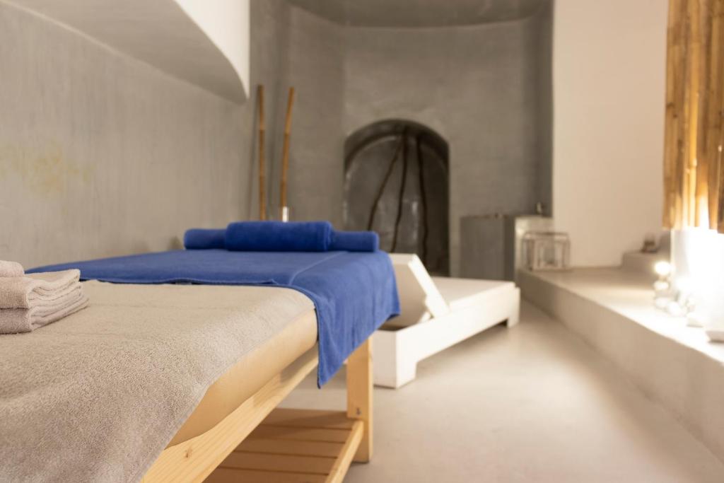Postel nebo postele na pokoji v ubytování Cavo Bianco Boutique Hotel & Spa
