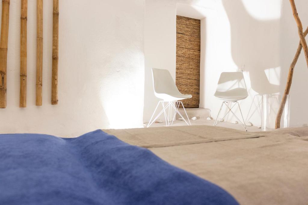 Postel nebo postele na pokoji v ubytování Cavo Bianco Boutique Hotel & Spa