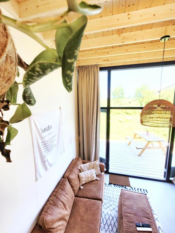 Posezení v ubytování Tiny House Lantliv Oostkapelle, bij de boer