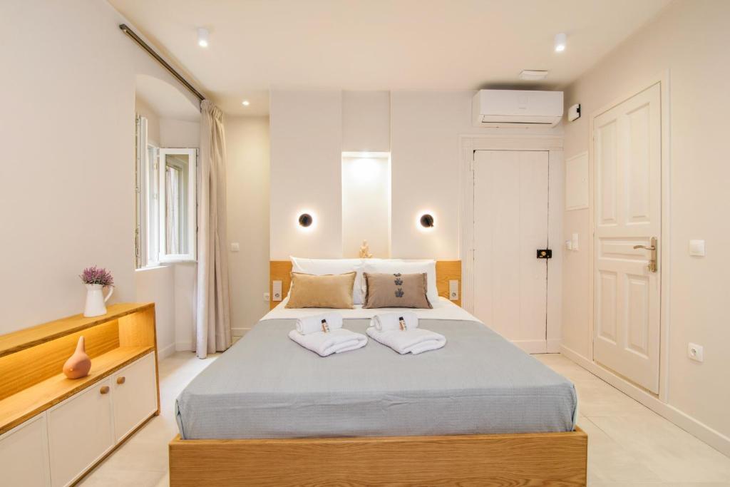A bed or beds in a room at Magnolia Corfu Suite