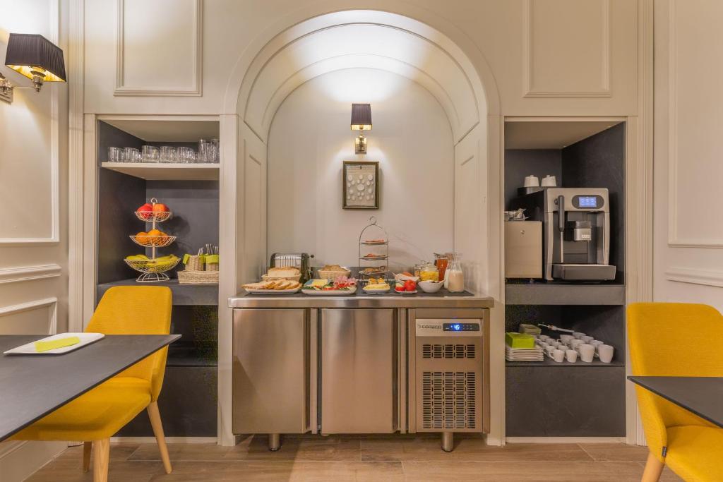 a kitchen with a counter with food on it at Belle Boutique in Sliema
