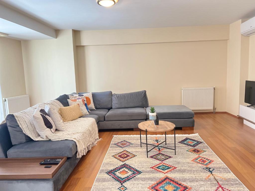 a living room with a couch and a table at New Studio Apartment, 1BR in Istanbul