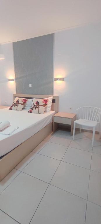 Postel nebo postele na pokoji v ubytování ILIDA apartments
