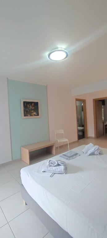Postel nebo postele na pokoji v ubytování ILIDA apartments