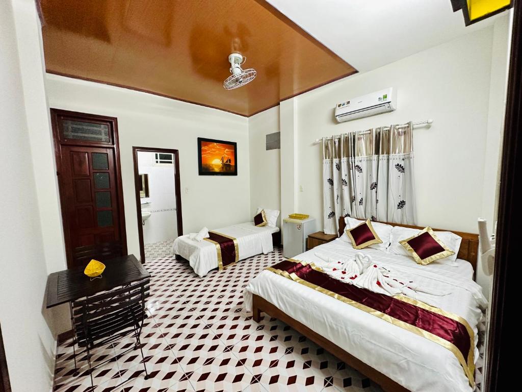 Postel nebo postele na pokoji v ubytování DK House Homestay