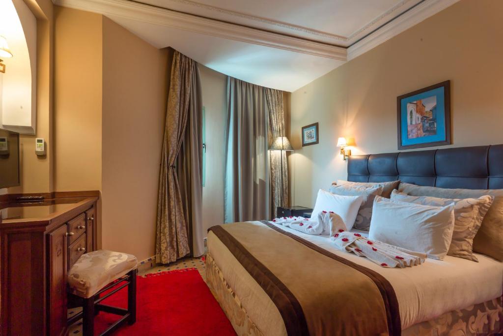 Postel nebo postele na pokoji v ubytování Le Caspien Boutique Hotel