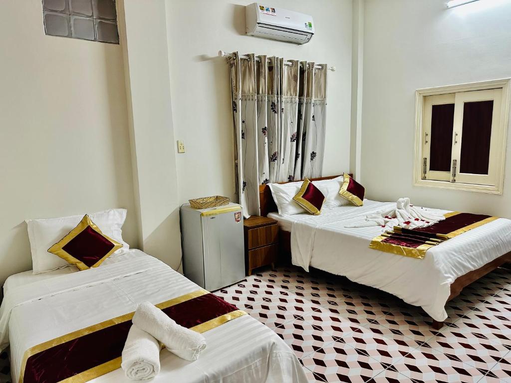 Postel nebo postele na pokoji v ubytování DK House Homestay