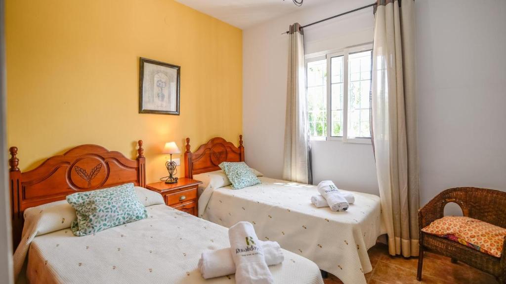 Posteľ alebo postele v izbe v ubytovaní Villa ManuelG Nerja by Ruralidays