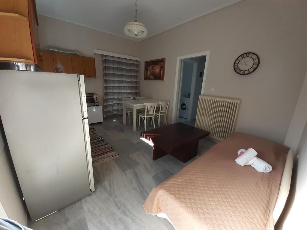 Kuchyň nebo kuchyňský kout v ubytování KAMARI APARTMENTS