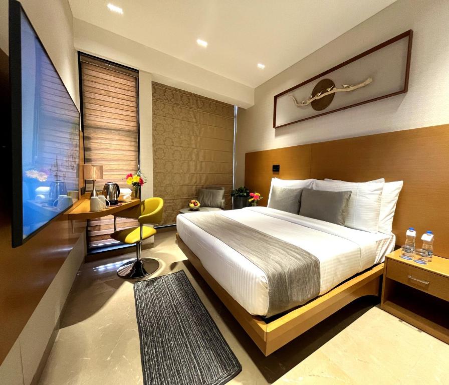 TV a/nebo společenská místnost v ubytování Morvee Hotels Alipore Kolkata