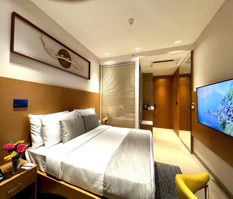 Postel nebo postele na pokoji v ubytování Morvee Hotels Alipore Kolkata