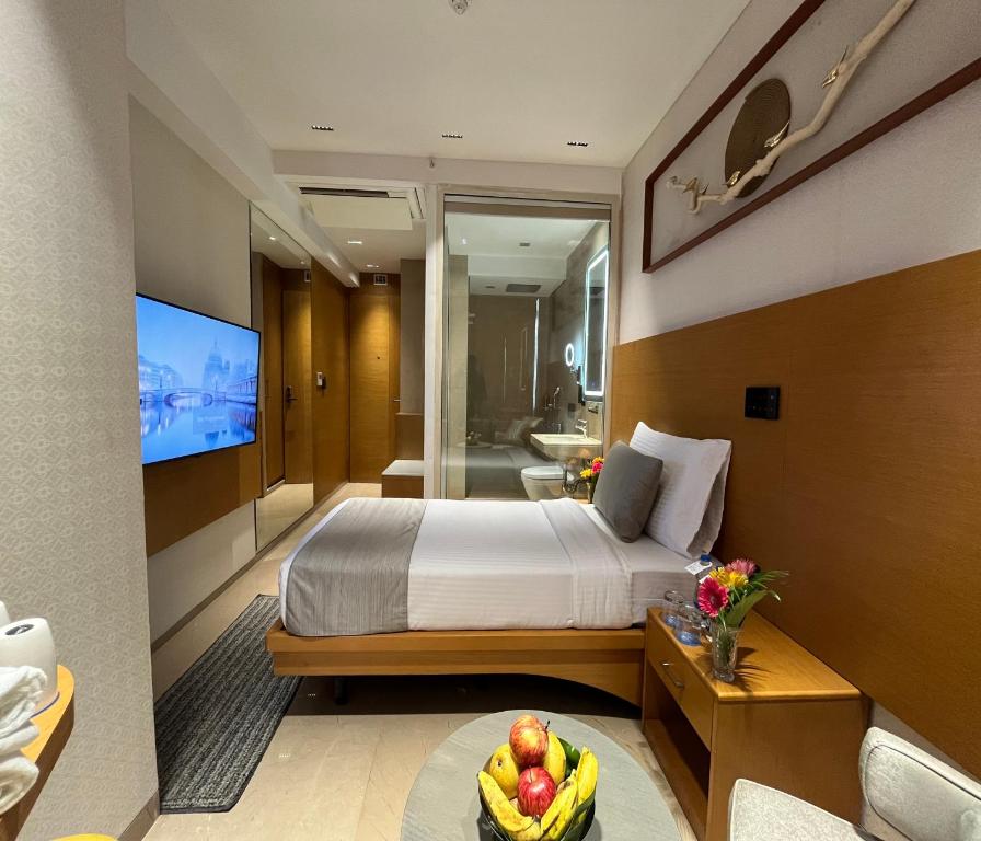 Postel nebo postele na pokoji v ubytování Morvee Hotels Alipore Kolkata