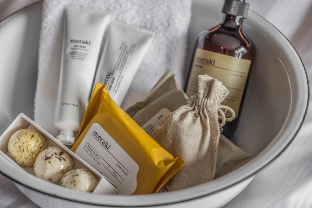 a hamper with a bottle of wine and other items at Aalborg Airport Hotel in Aalborg