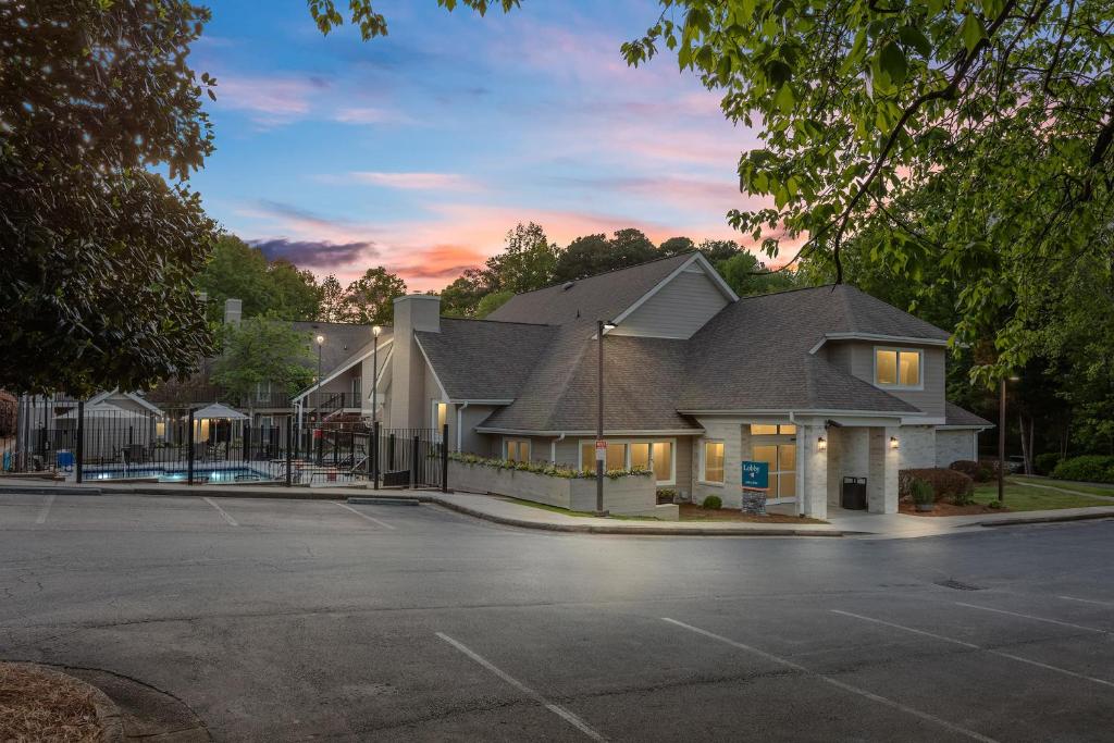 a house with a parking lot in front of it at WaterWalk Atlanta Perimeter Center in Atlanta
