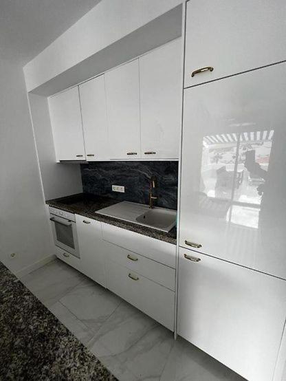 Kuchyň nebo kuchyňský kout v ubytování Apartment Malibu Sun & Relax