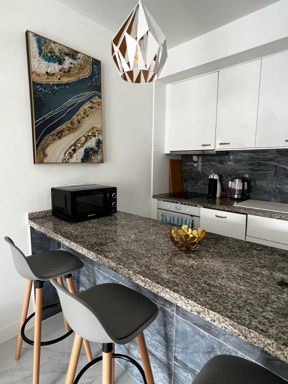 Kuchyň nebo kuchyňský kout v ubytování Apartment Malibu Sun & Relax