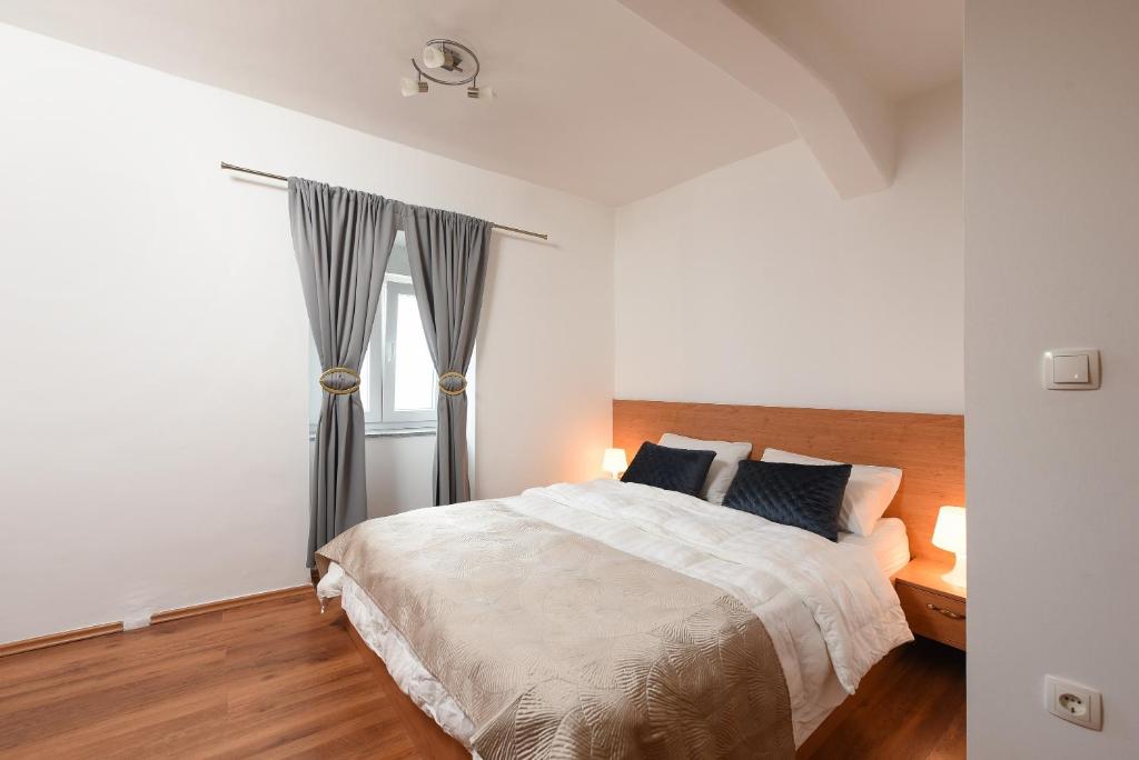 Postel nebo postele na pokoji v ubytování Villa Zaton