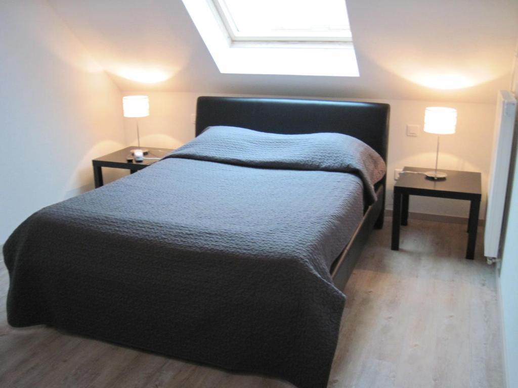 Postel nebo postele na pokoji v ubytování Hôtel Des Bois