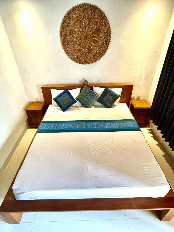 Postel nebo postele na pokoji v ubytování DIMUWA Ubud