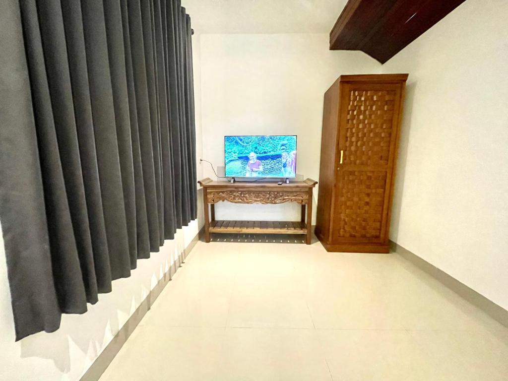 TV a/nebo společenská místnost v ubytování DIMUWA Ubud