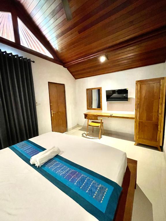 Postel nebo postele na pokoji v ubytování DIMUWA Ubud