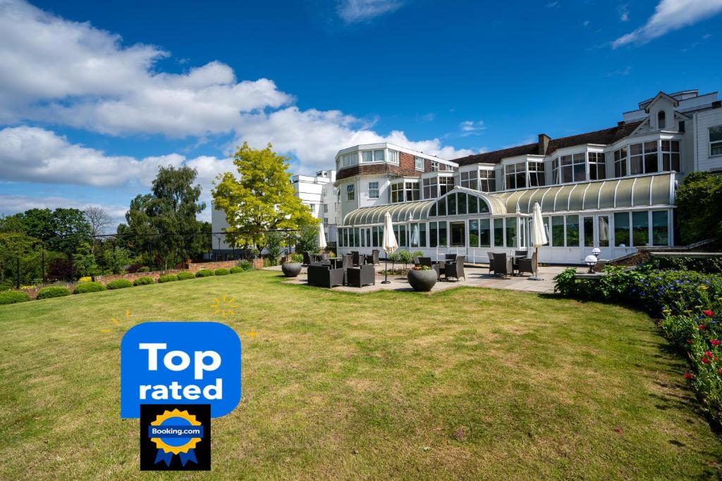 a building with a top rated sign in front of it at Bromley Court Hotel London in Bromley