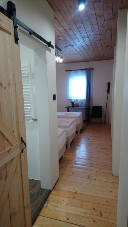 Postel nebo postele na pokoji v ubytování Na Wyraju