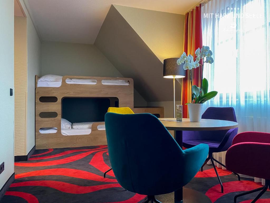 Postel nebo postele na pokoji v ubytování HKK Hotel Wernigerode