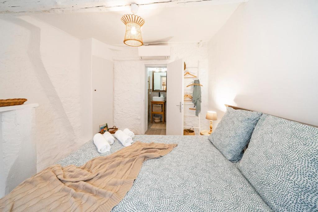 Łóżko lub łóżka w pokoju w obiekcie La Maison de l'Âne