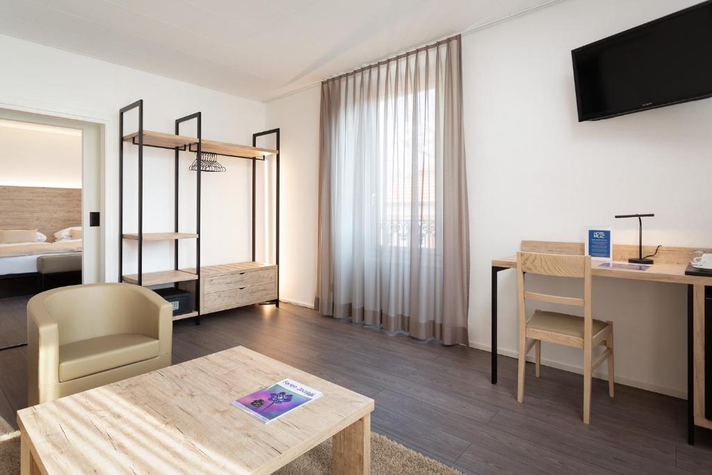 Postel nebo postele na pokoji v ubytování Hotel Du Lac