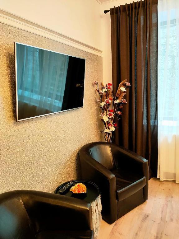 Una televisión o centro de entretenimiento en 22 LOOP Apartment
