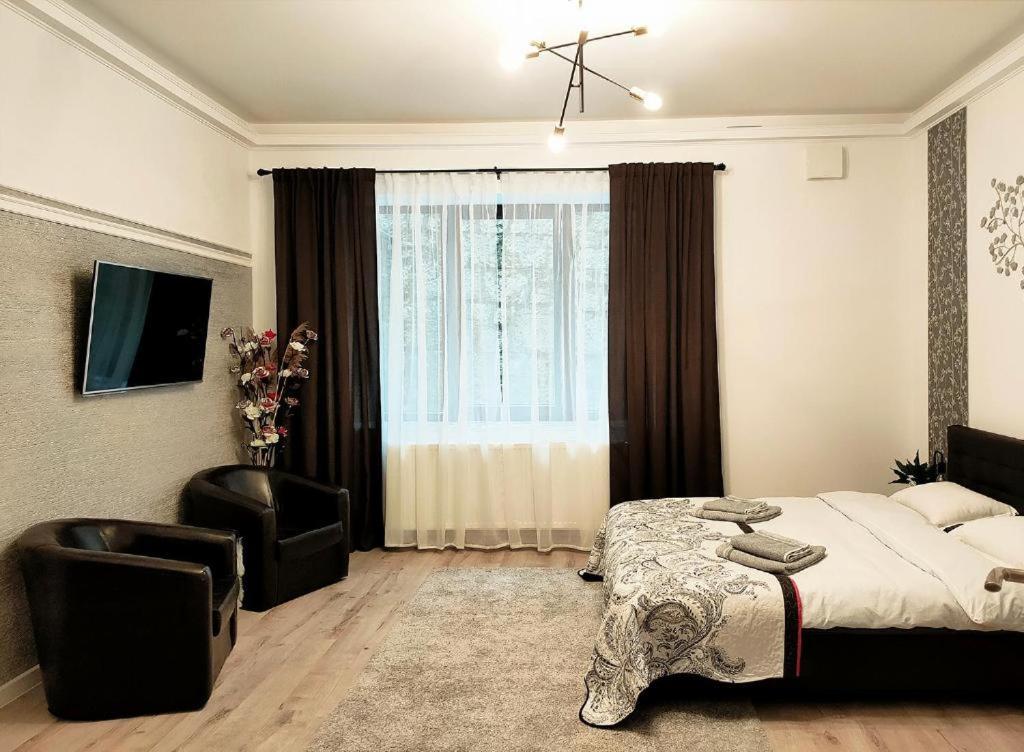 Una cama o camas en una habitación de 22 LOOP Apartment