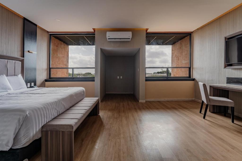 Postel nebo postele na pokoji v ubytování Hotel Kavia Premium - Paseo Montejo