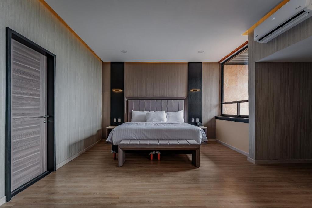 Postel nebo postele na pokoji v ubytování Hotel Kavia Premium - Paseo Montejo
