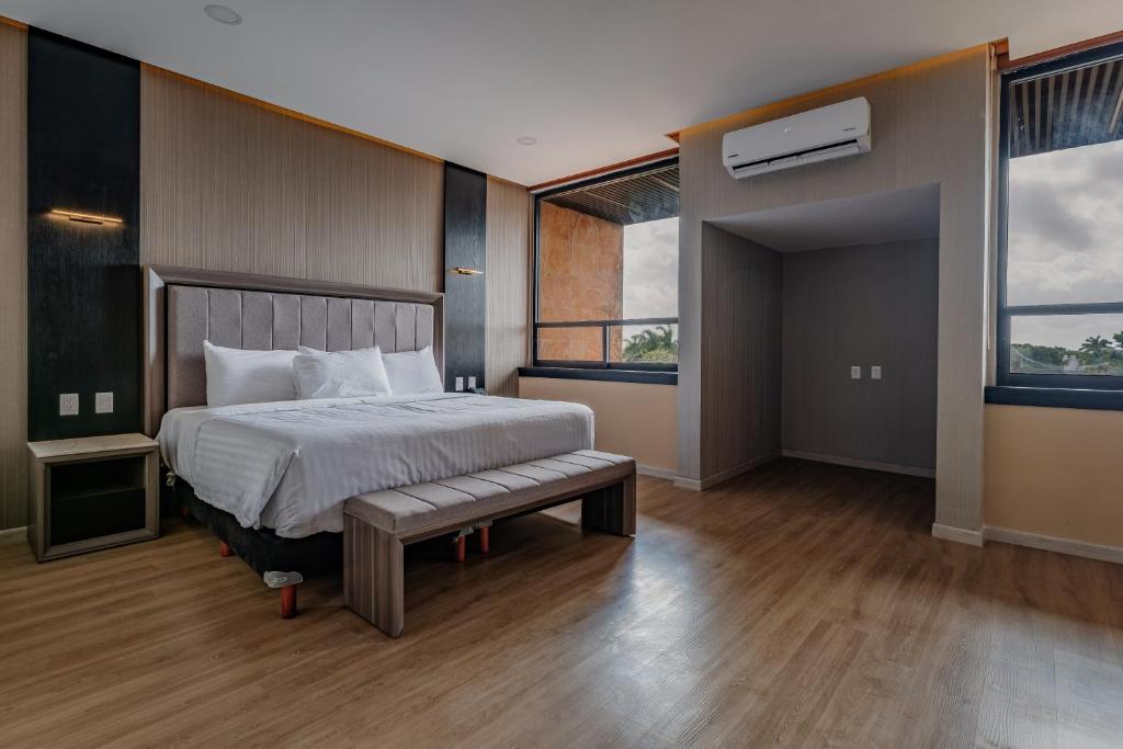 Postel nebo postele na pokoji v ubytování Hotel Kavia Premium - Paseo Montejo