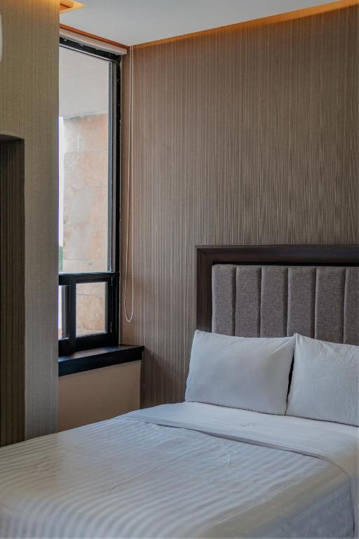 Postel nebo postele na pokoji v ubytování Hotel Kavia Premium - Paseo Montejo