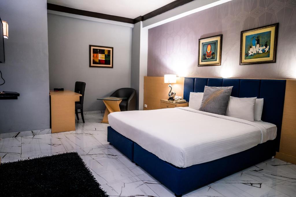 Postel nebo postele na pokoji v ubytování Hotel Pal Heights