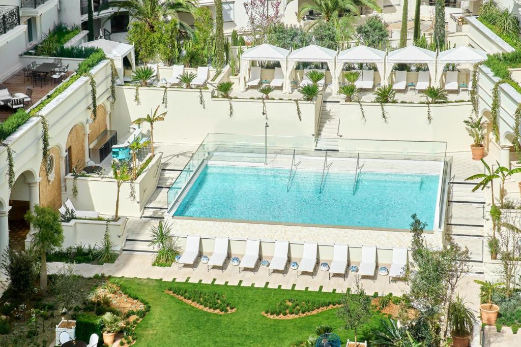 an overhead view of a swimming pool in a building at Carlton Cannes, a Regent Hotel in Cannes