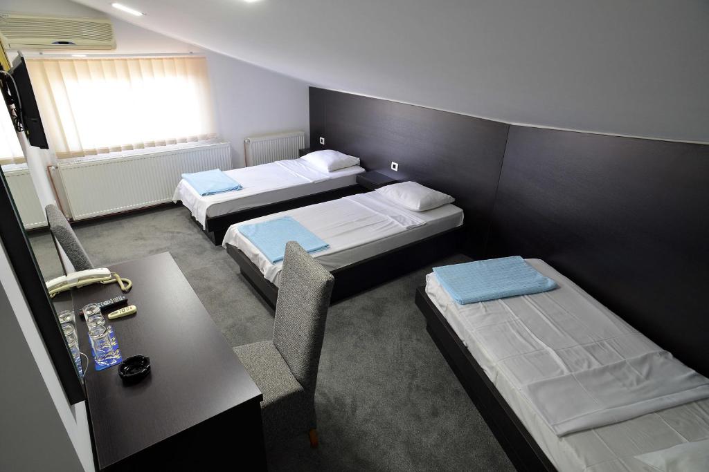 Postel nebo postele na pokoji v ubytování Hotel Golf