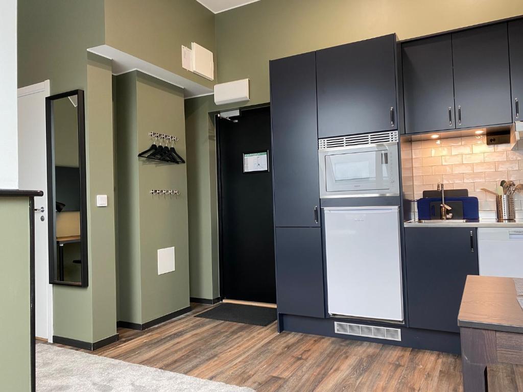 Kuchyň nebo kuchyňský kout v ubytování Magnolia House Sollentuna