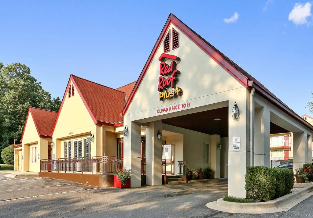 a building with a sign that reads gambling club at Red Roof Inn PLUS+ Washington DC Rockville in Rockville