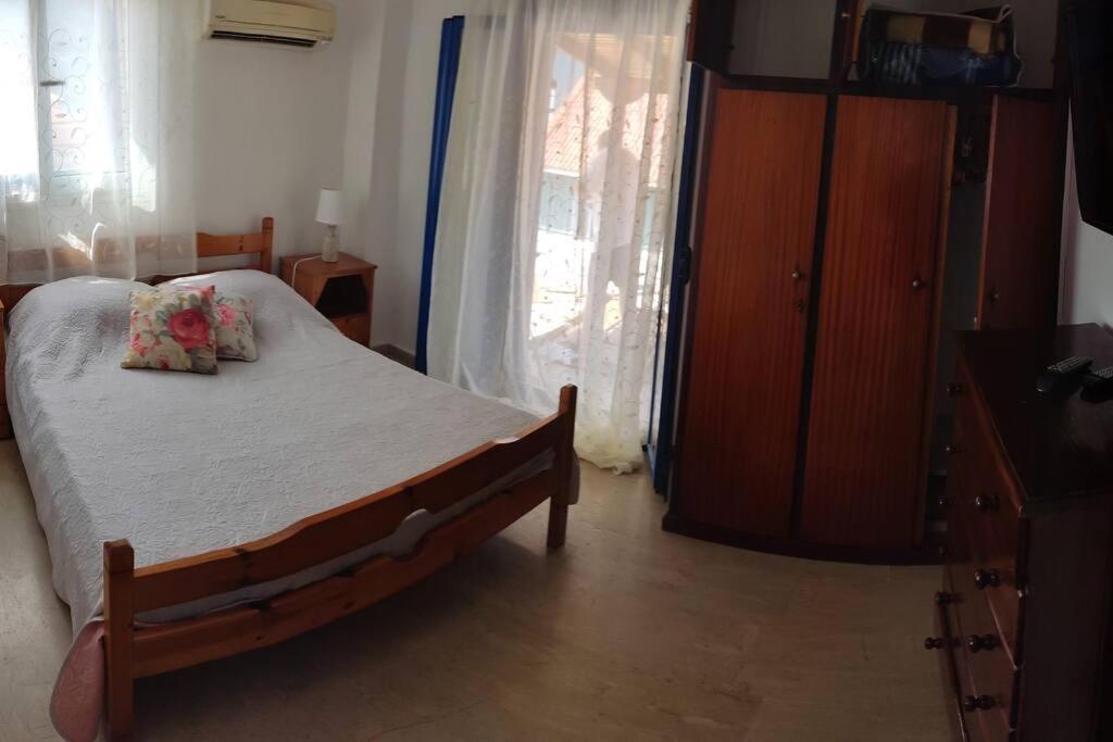 Postel nebo postele na pokoji v ubytování Thea Mytikas