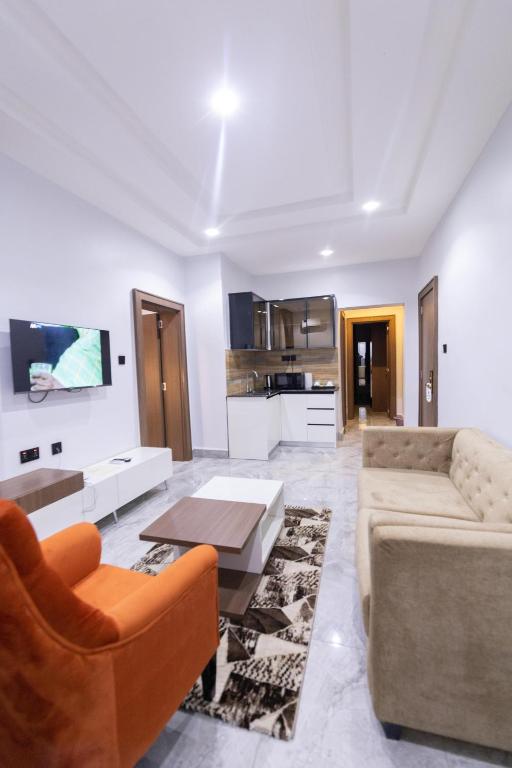 TV a/nebo společenská místnost v ubytování Tranquila Hotels and Suites Abuja