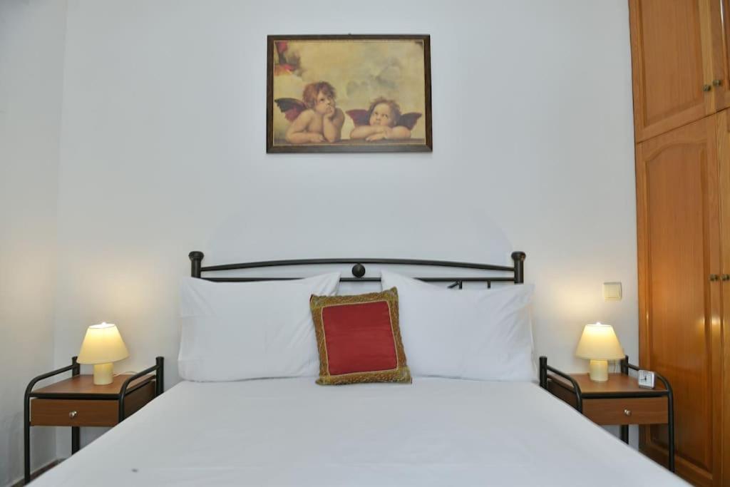 A bed or beds in a room at Maria's House