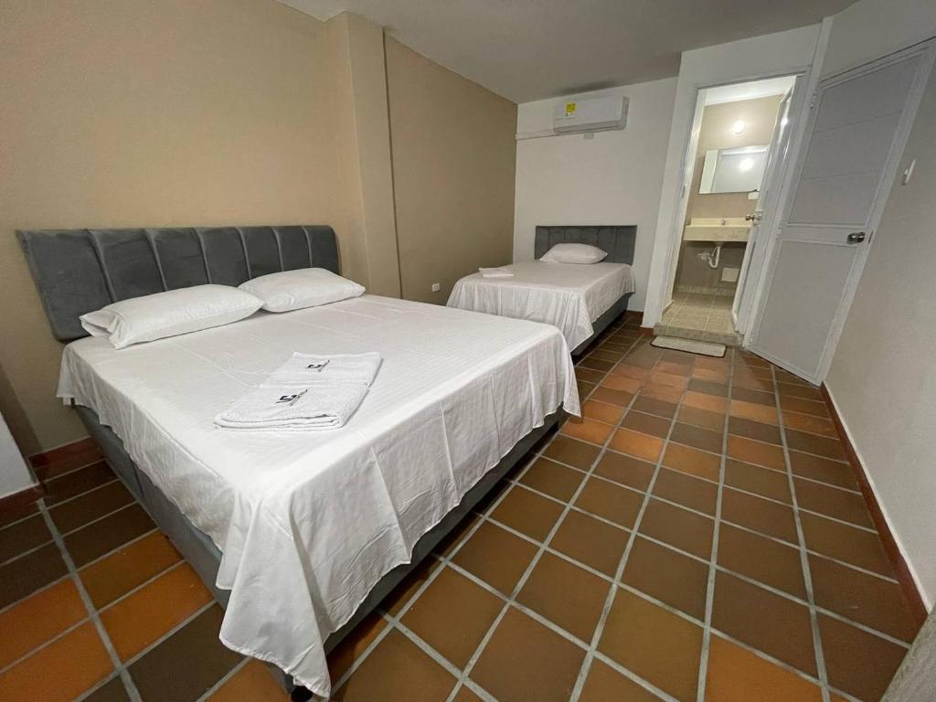 Postel nebo postele na pokoji v ubytování Hotel Valle Central