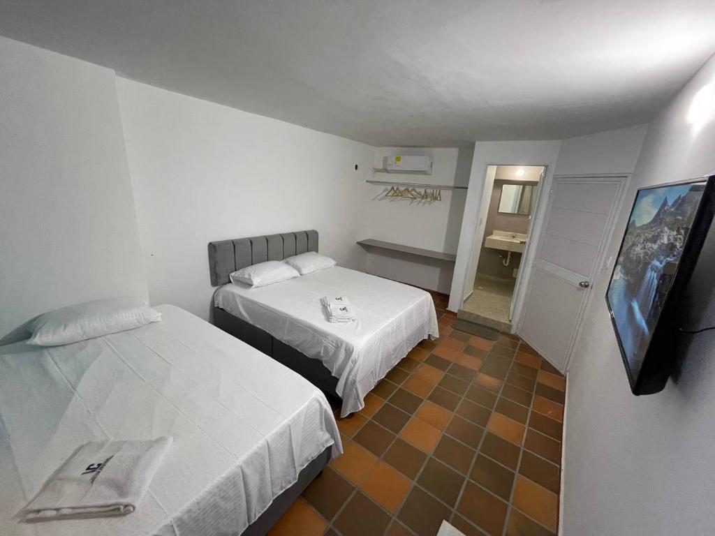 Postel nebo postele na pokoji v ubytování Hotel Valle Central